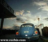 Picture of a VW Bug at a Gas Station